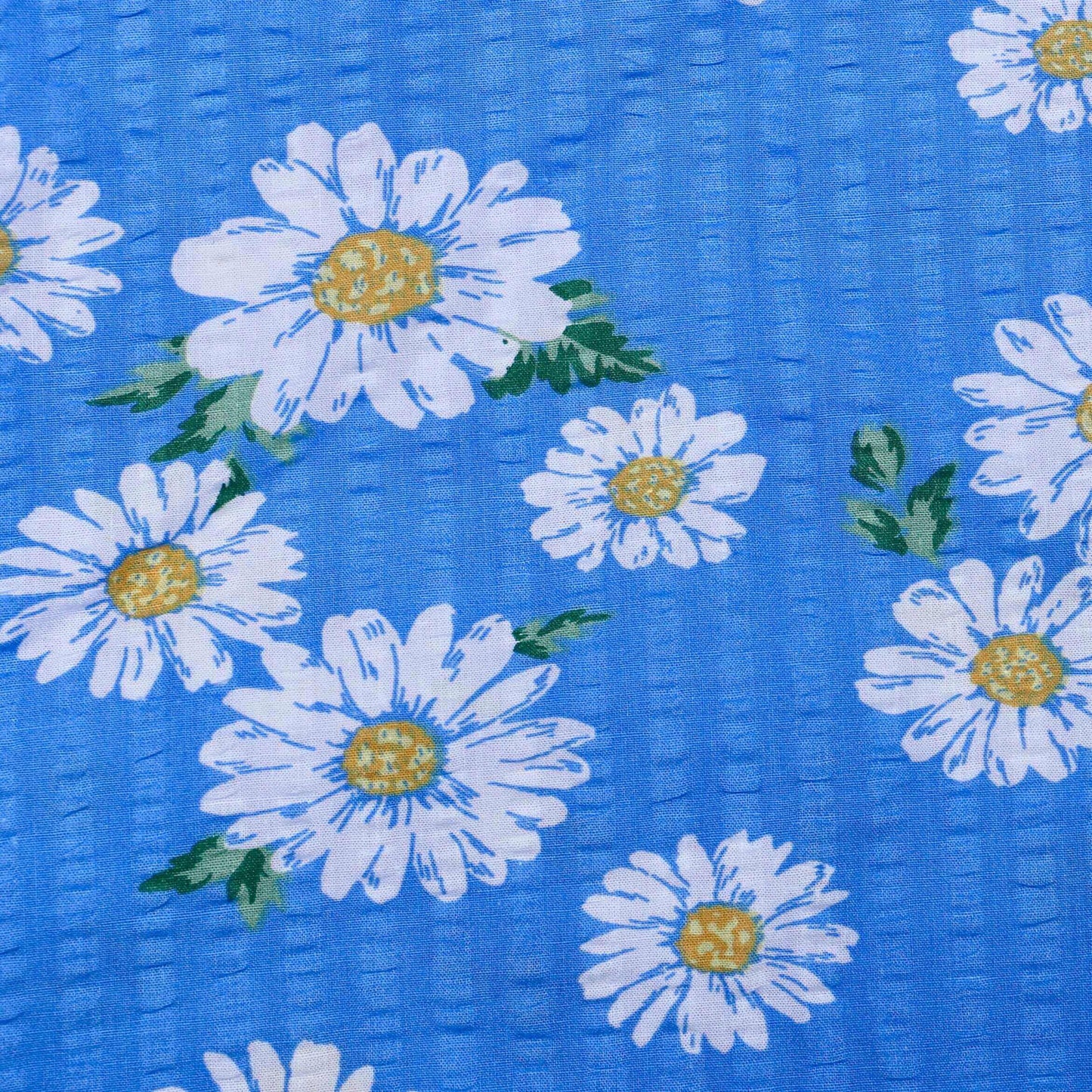 seersucker cotton fabric with blue background and white daisy print