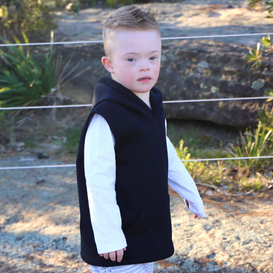 Boy wearing Black Fleece Sleeveless Hoodie ethically made in Australia with a Cotton blend soft cosy Fleece