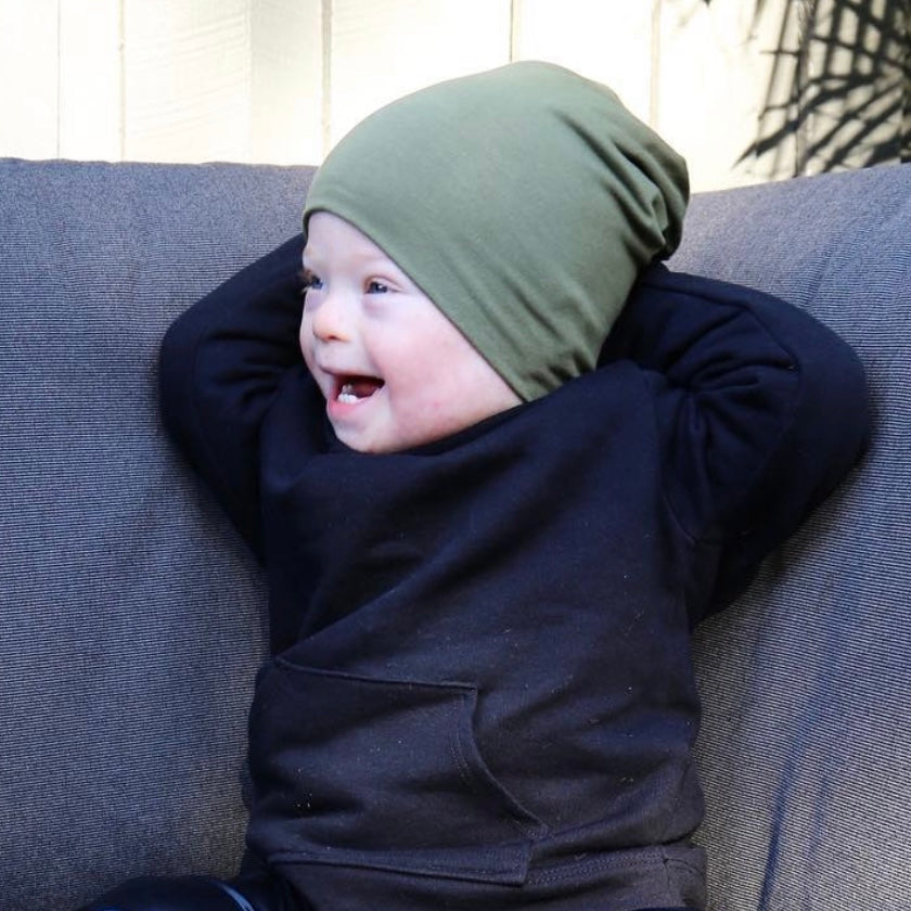 boy wearing khaki slouchy beanie. Ethichally made in australia with stretch cotton super soft jersey