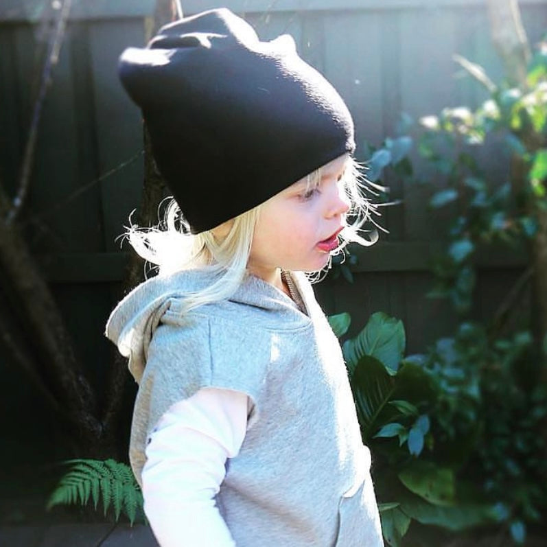 boy wearing black slouchy beanie. Ethichally made in australia with stretch cotton ponte fabric