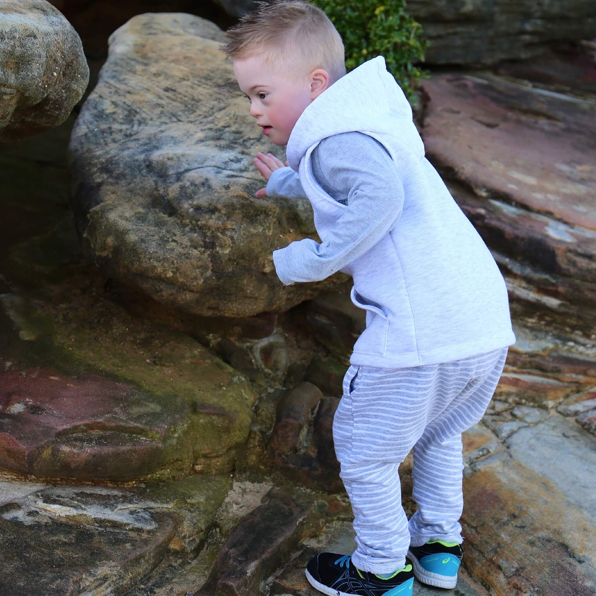 Boy wearing White Marle Sleeveless Hoodie ethically made in Australia with a Cotton blend soft cosy Fleece