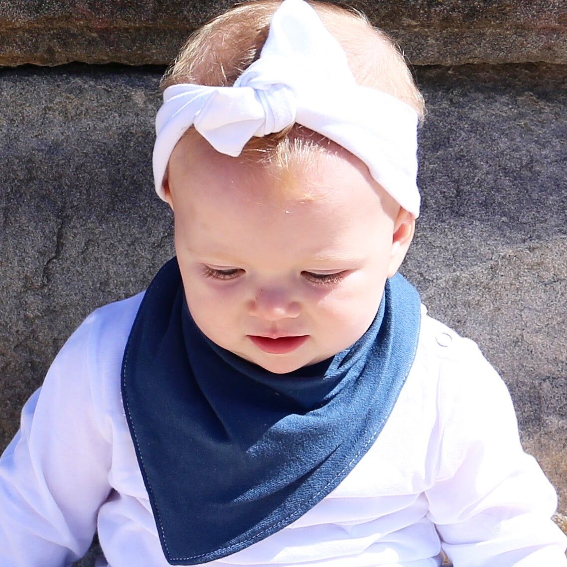 baby wearing blue dribble bib. ethically made in australia with 100% cotton jersey and terry towleling lining.